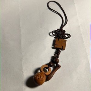 Beautiful wood carved bell phone strap